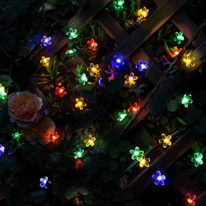 A Fence Decorated by Gigalumi Multi-color Solar Flower String Lights